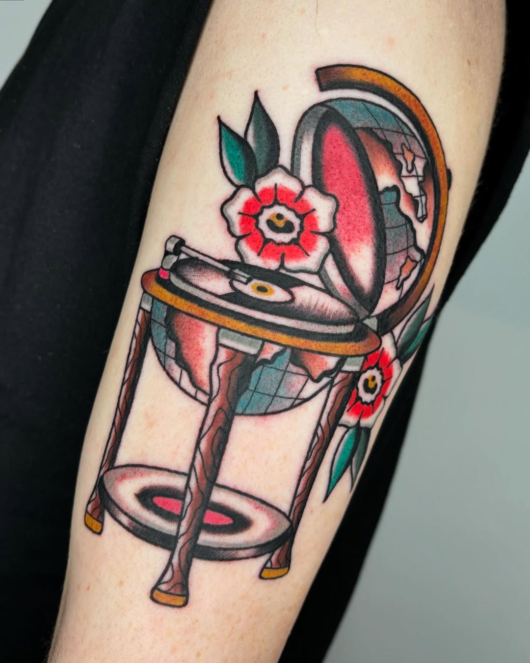 Unique globe tattoo with floral accents Tattoo Design