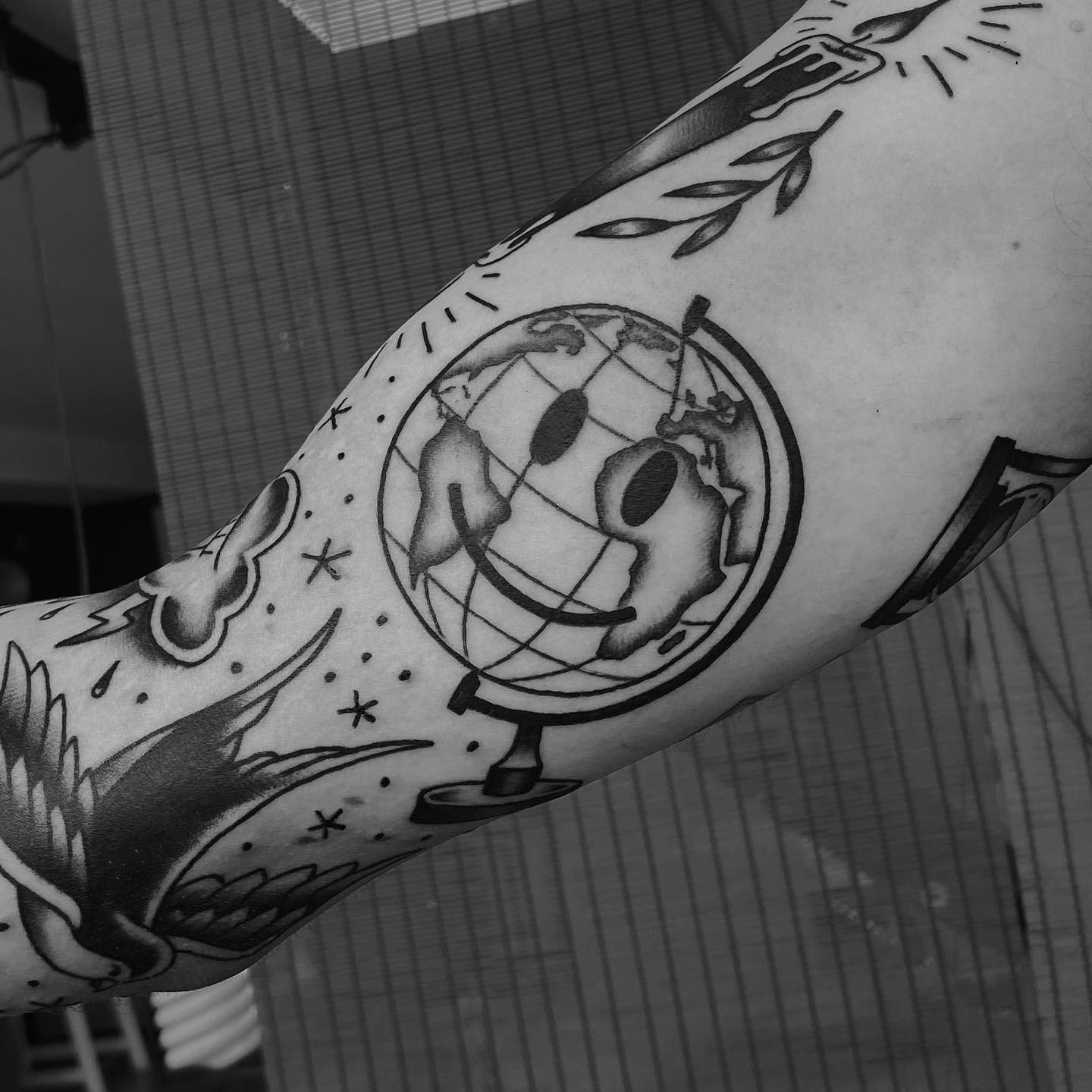 Whimsical globe tattoo with a cheerful vibe Tattoo Design