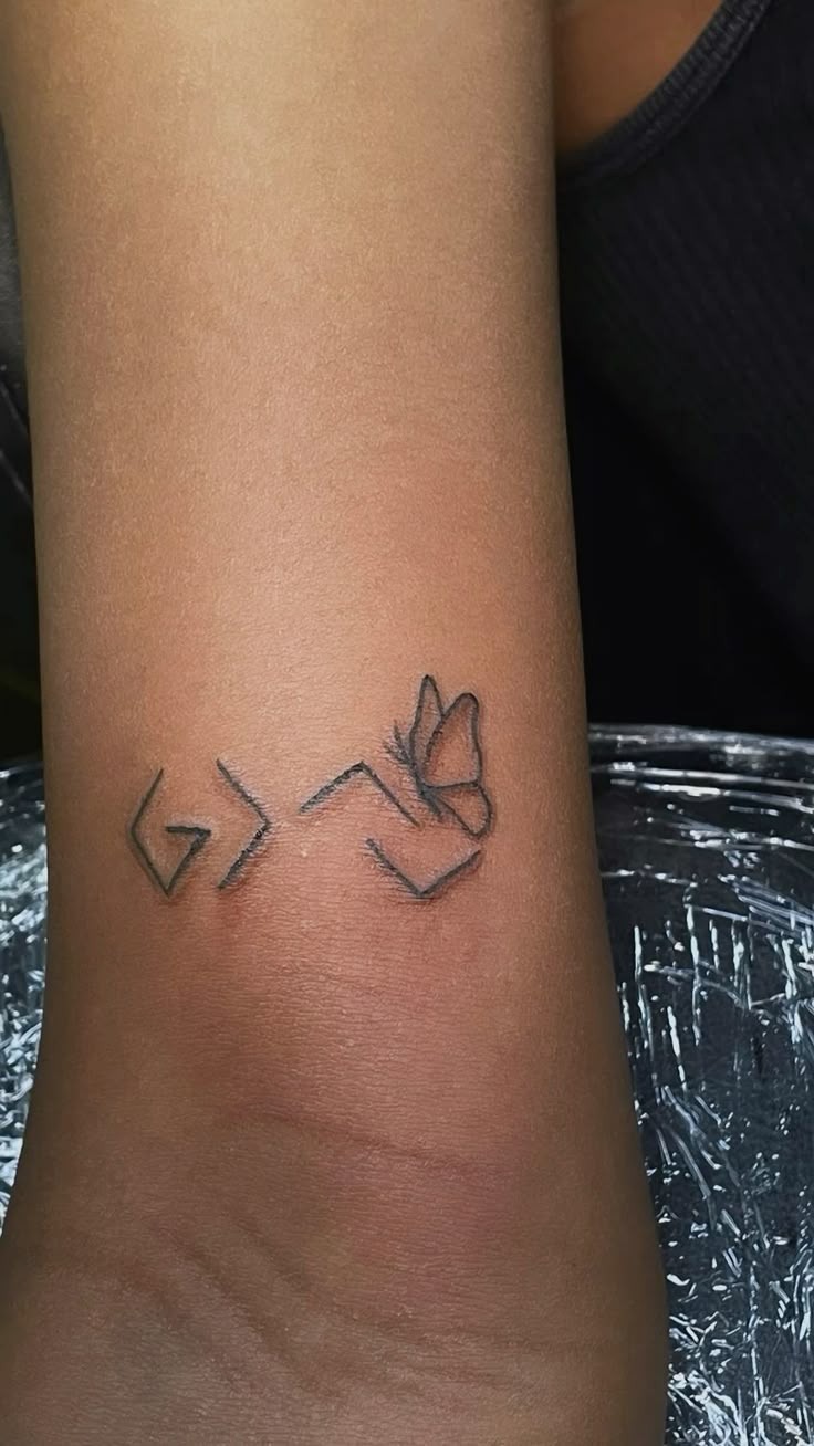 Vertical Arrow and Vine Symbol Tattoo Tattoo Design
