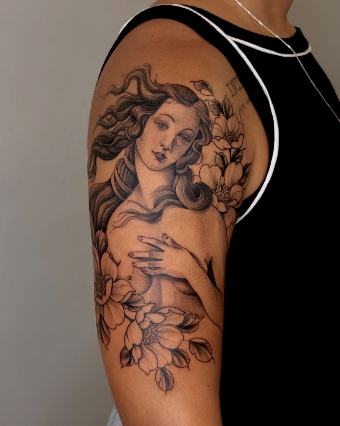 Floral Venus Portrait on the Arm Tattoo Design