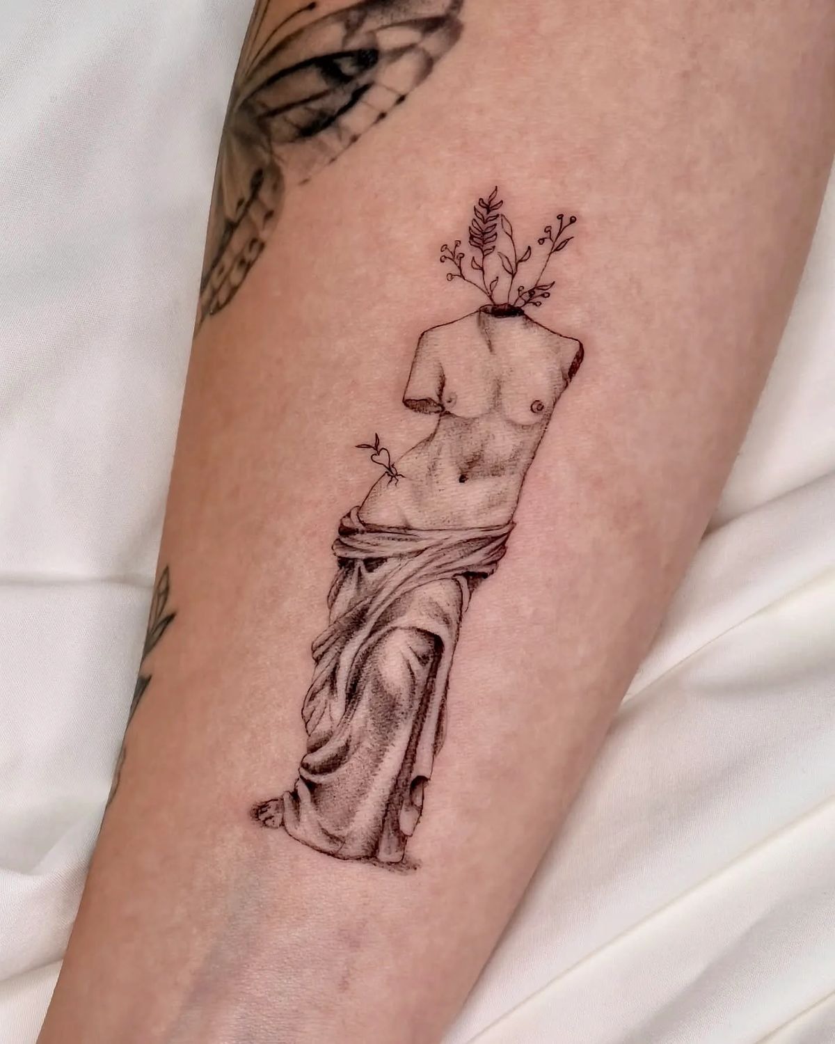 Venus de Milo Torso With Botanical Growth Tattoo Design