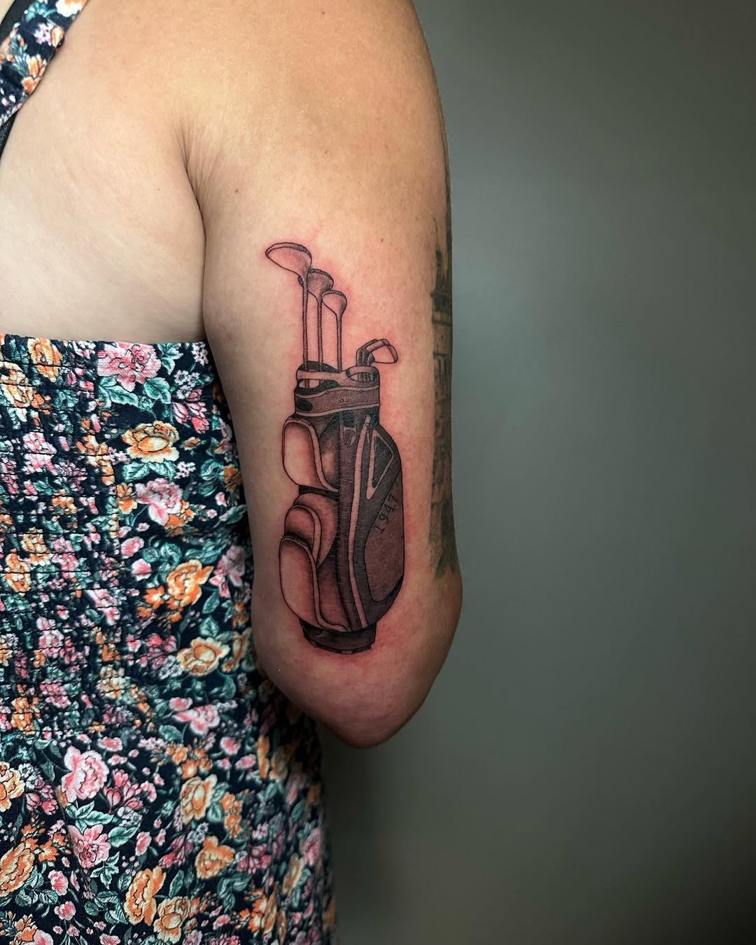 Detailed tattoo of golf clubs on arm Tattoo Design