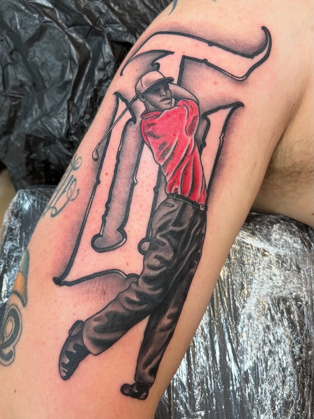 Dynamic golf tattoo capturing a perfect swing Tattoo Design