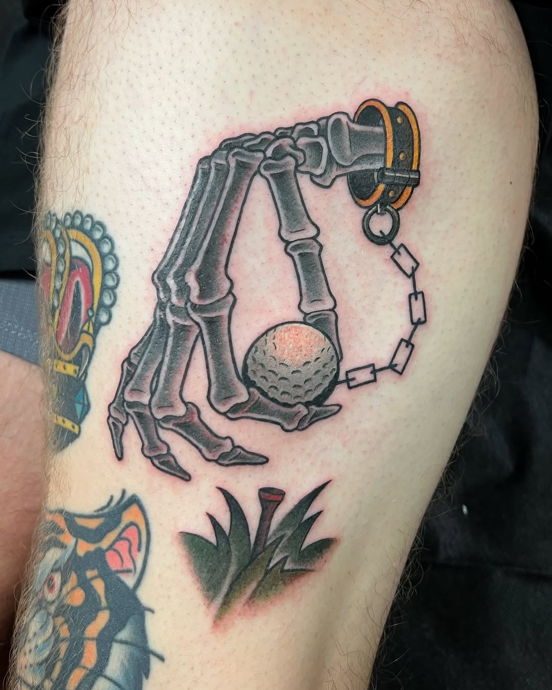 Intriguing skeleton hand with golf ball tattoo Tattoo Design