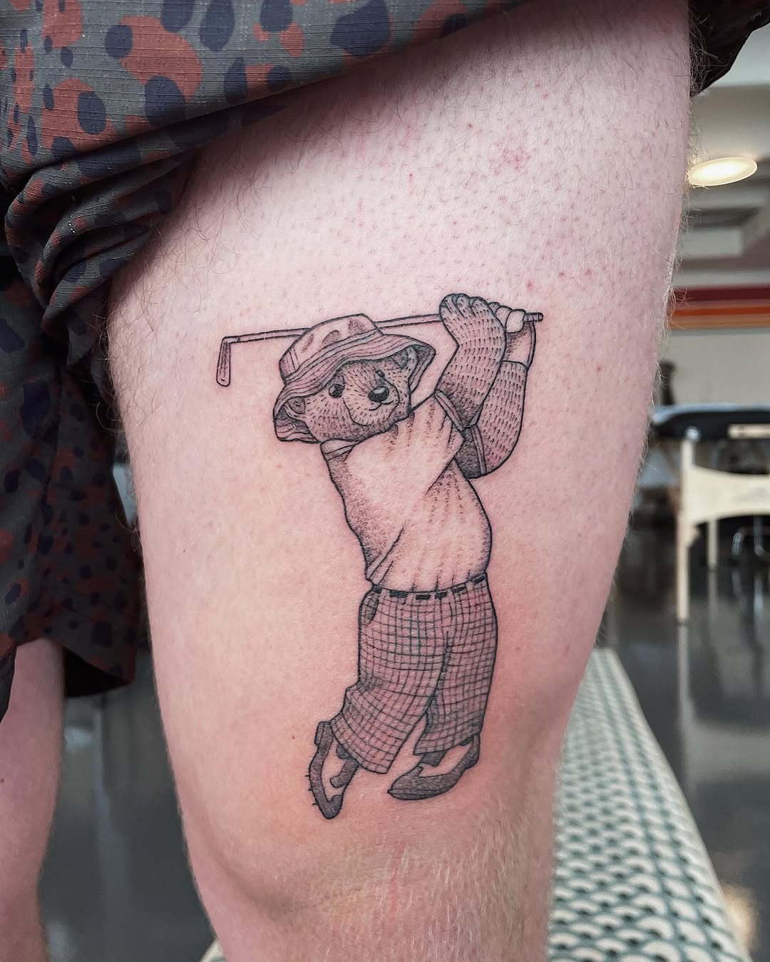 Playful koala golf tattoo with stylish attire Tattoo Design