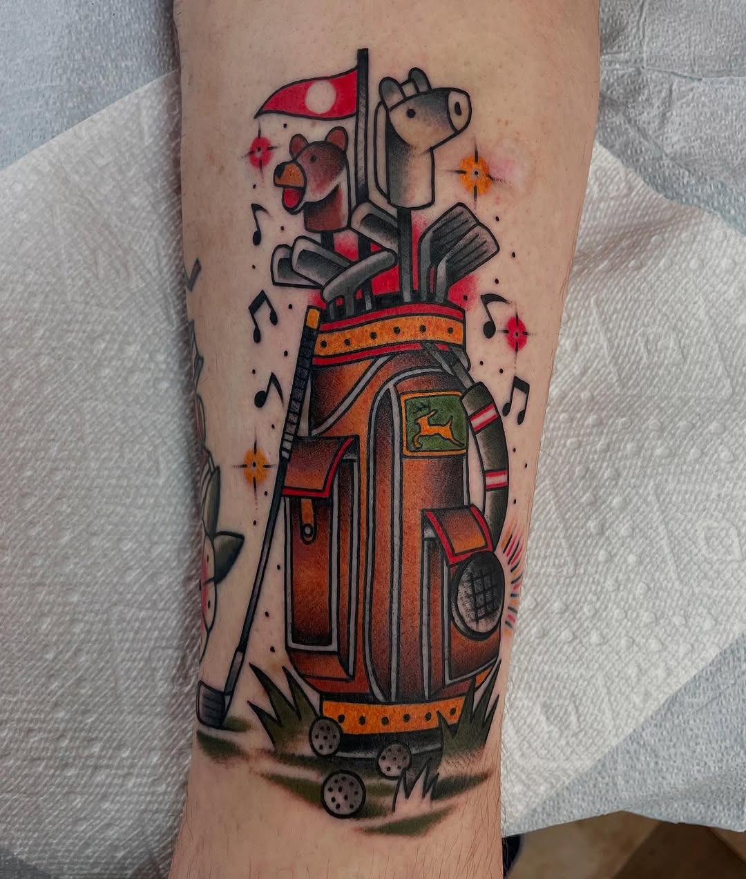 Whimsical golf bag tattoo with playful elements Tattoo Design