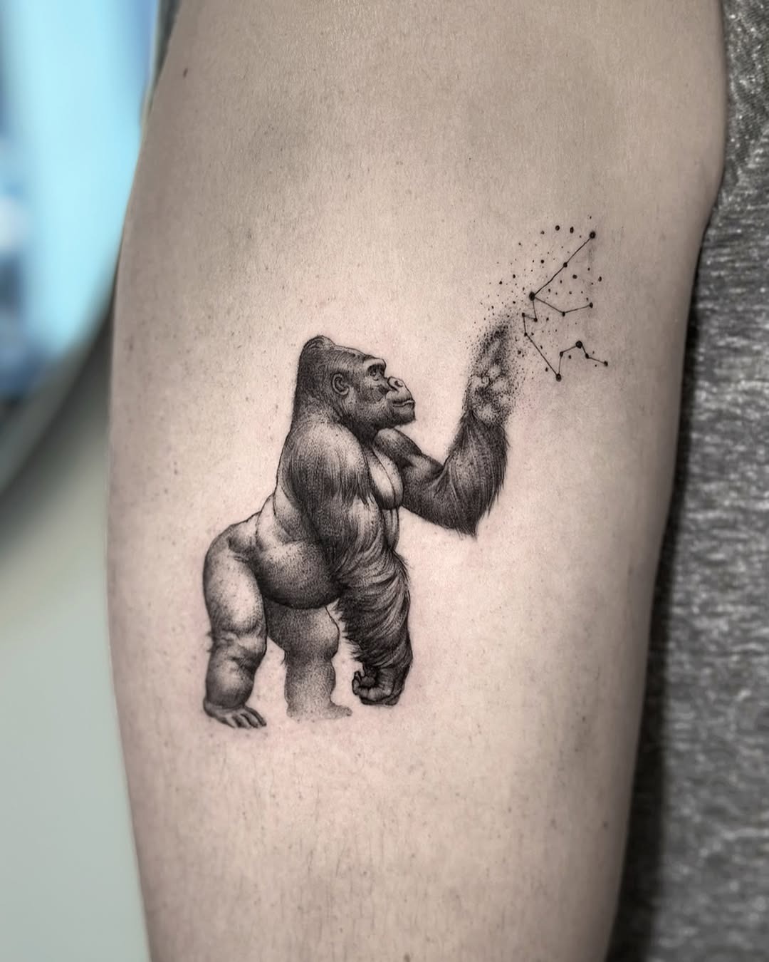 This stunning gorilla tattoo showcases an intricately detailed design that blends realism with artistry.