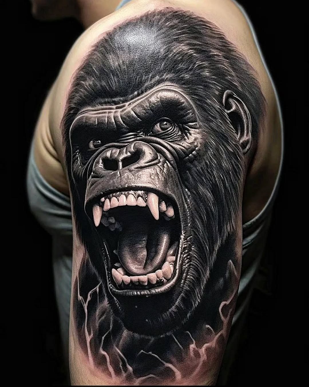 This stunning tattoo showcases a fierce gorilla in intricate detail.