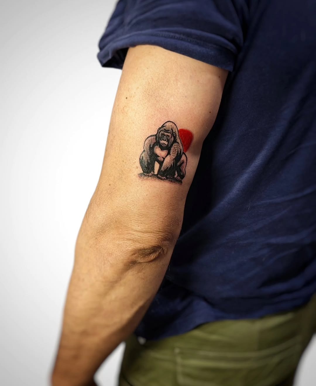 This tattoo showcases a beautifully detailed gorilla, exuding strength and majesty.