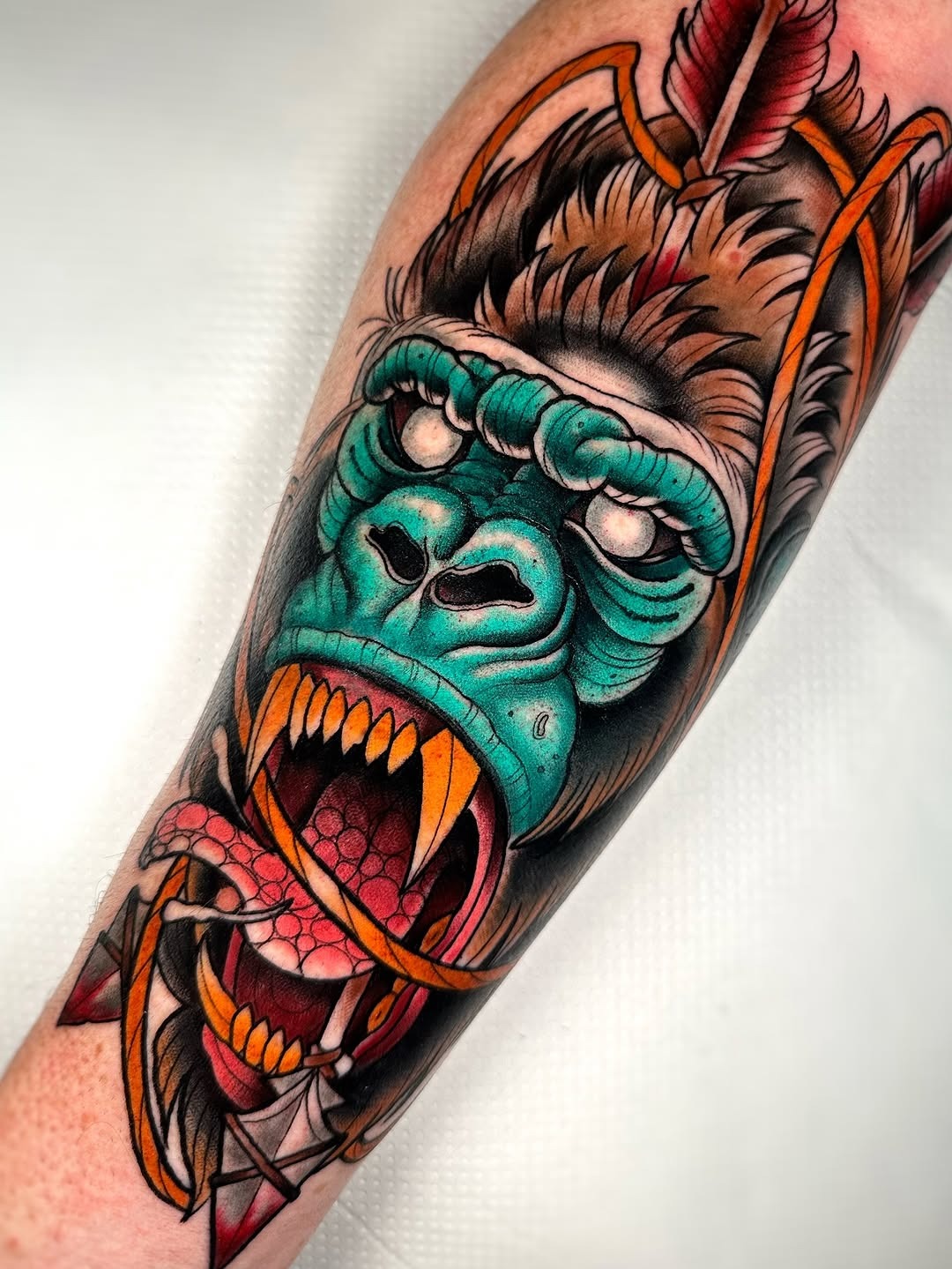 This stunning gorilla tattoo showcases colors and intricate detailing.