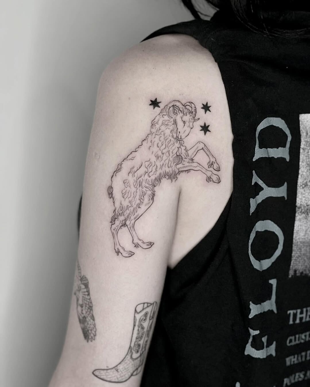 Charming goat tattoo with celestial accents Tattoo Design
