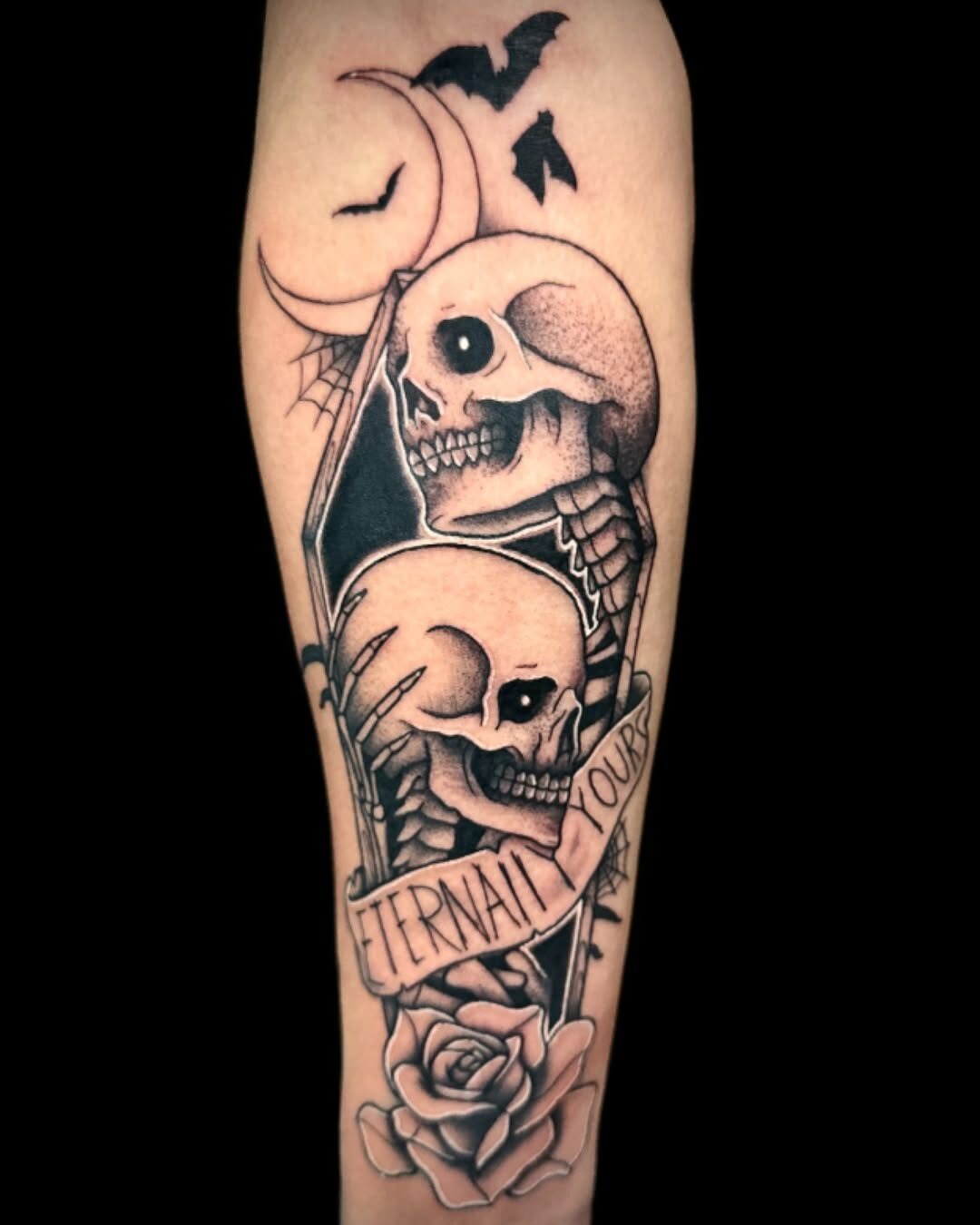 Eerie skeletons amidst moon and roses Tattoo Design