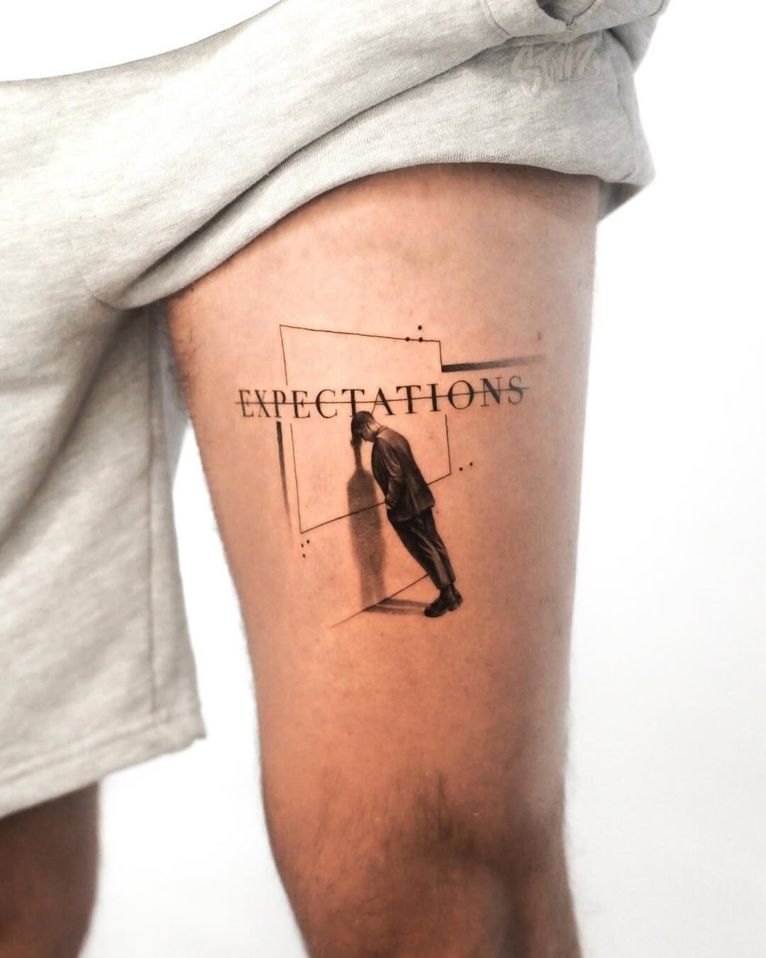 Intriguing expectations tattoo on thigh Tattoo Design