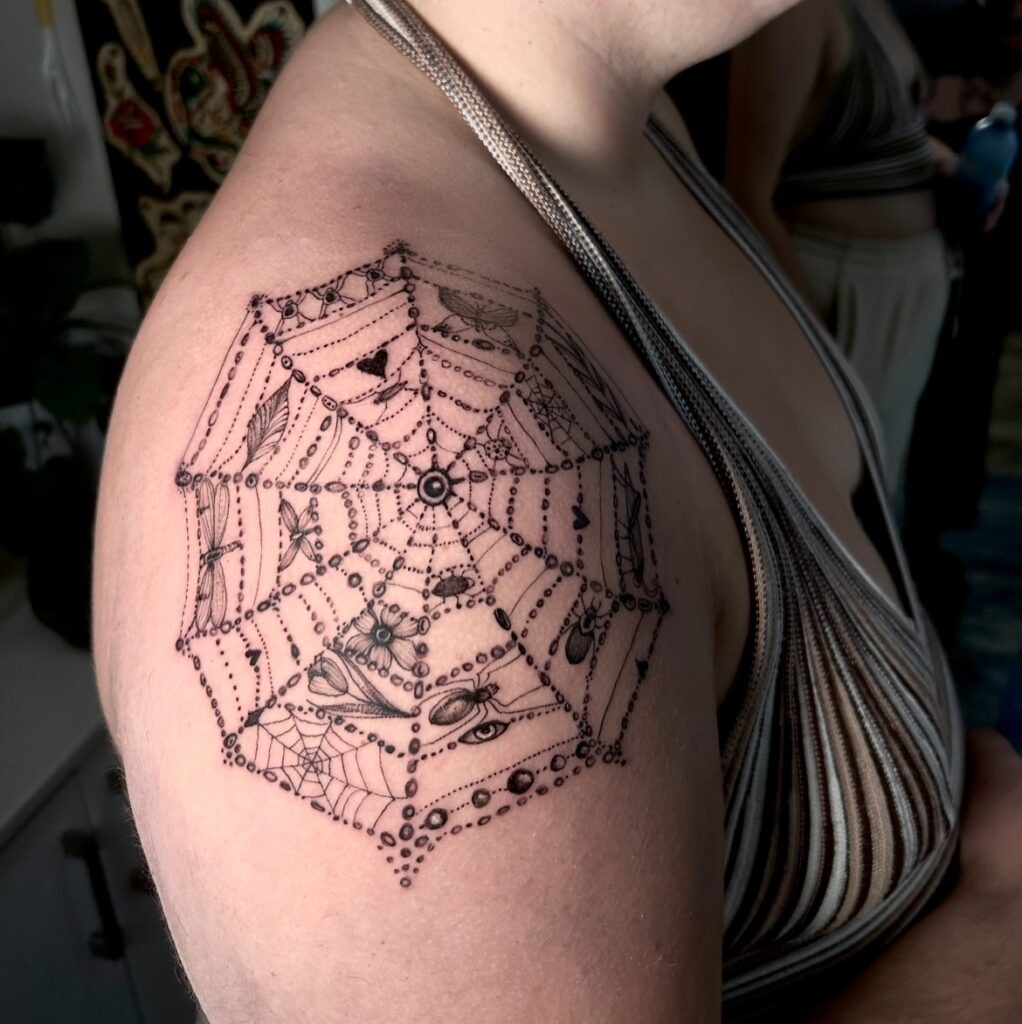 Gothic Spiderweb Shoulder Tattoo with Hidden Details Tattoo Design