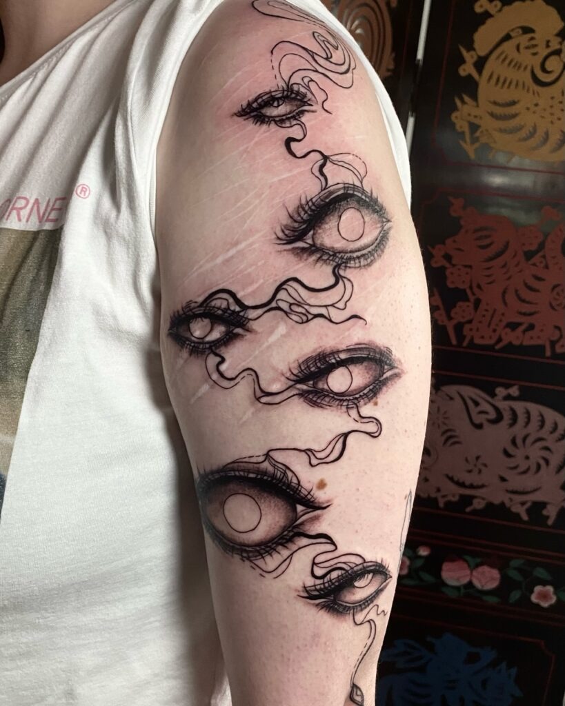 Surreal Gothic Eyes Tattoo with Flowing Smoke Tattoo Design