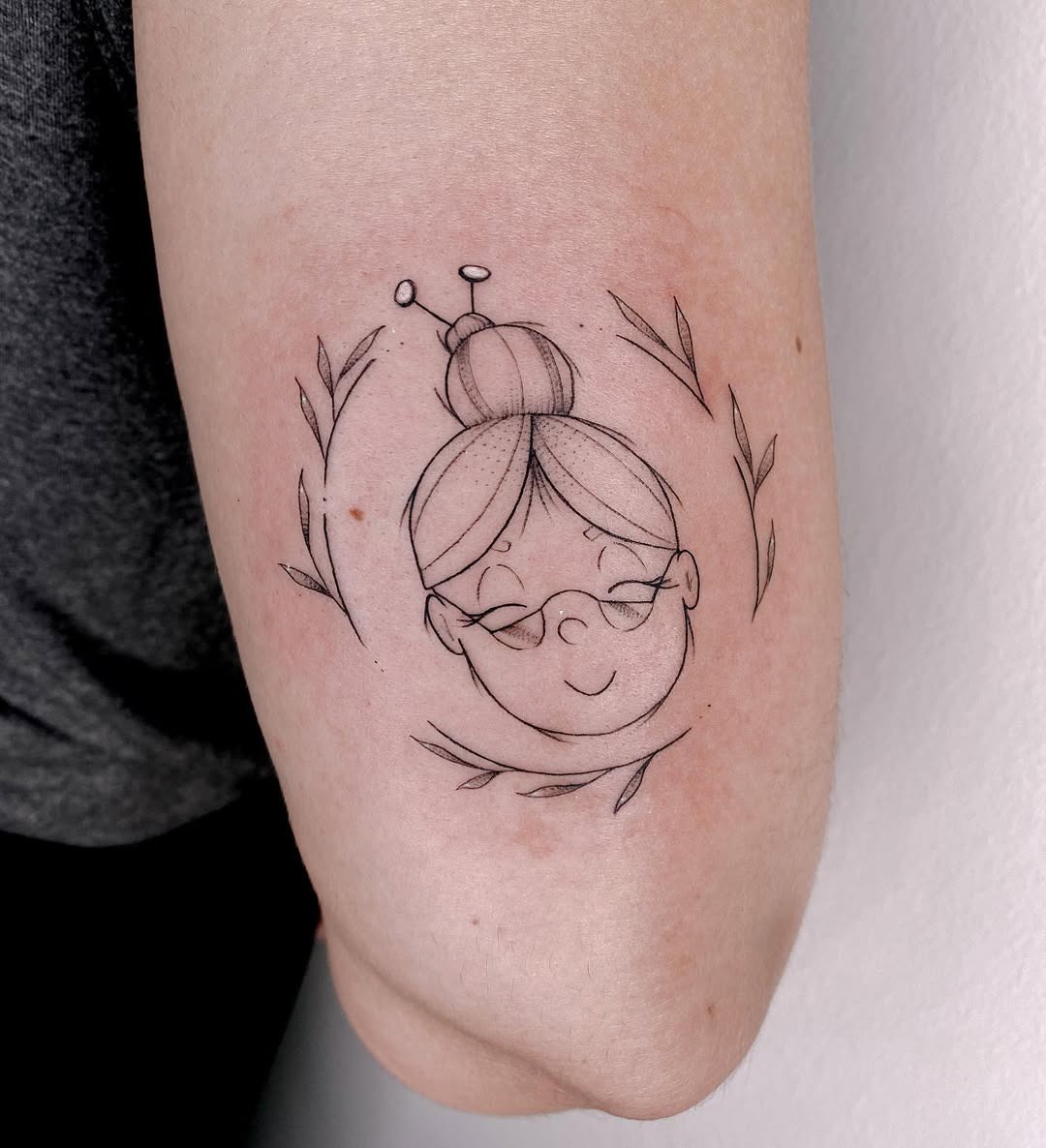 Charming line art of a playful grandmother Tattoo Design