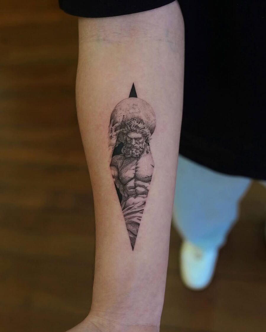This tattoo portrays Zeus in a mesmerizing black and gray style.