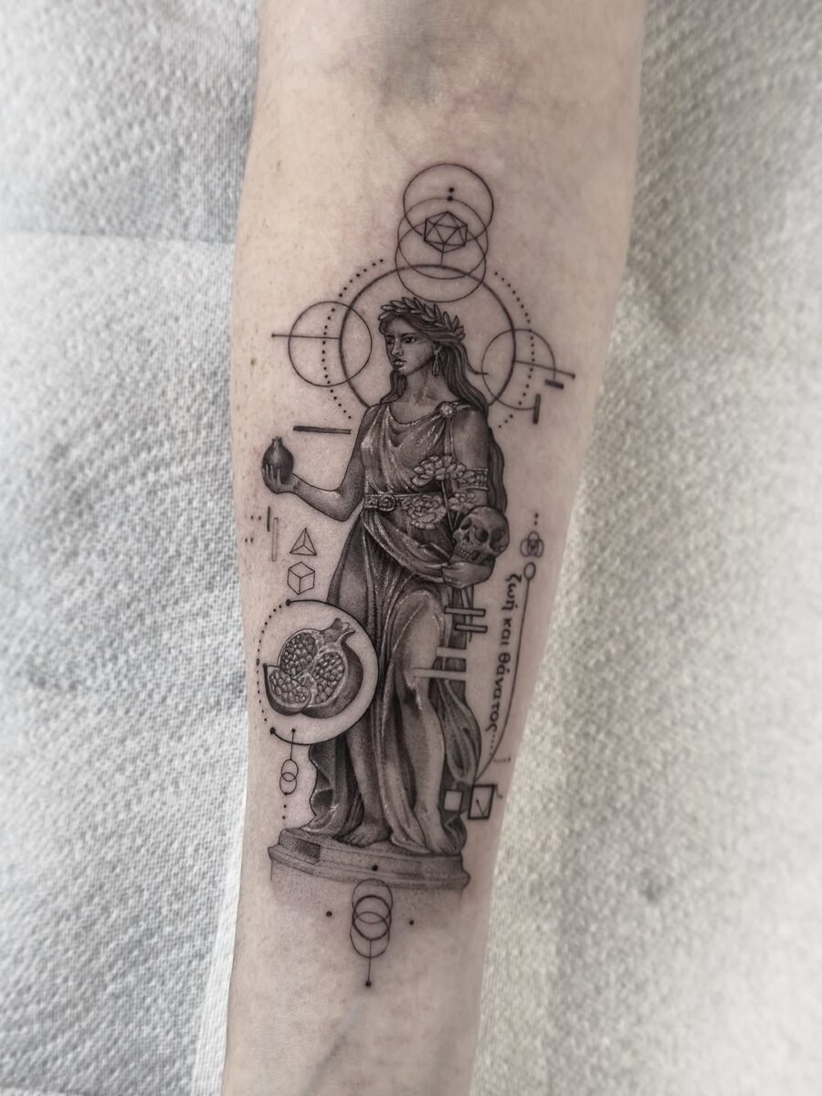 This tattoo features Athena, the Greek goddess of wisdom, depicted in stunning blackwork style.