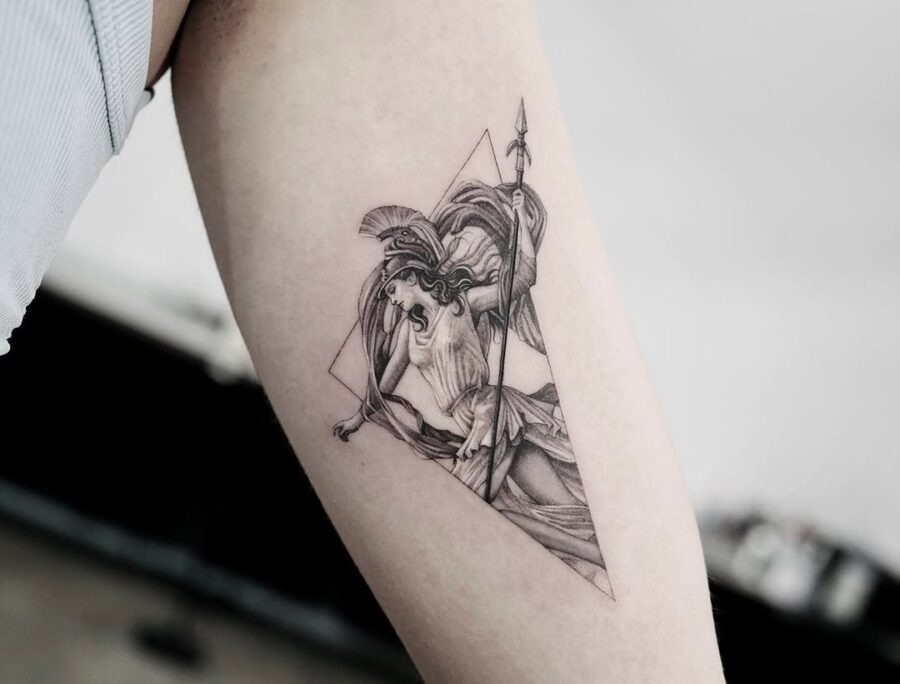 This tattoo features the powerful goddess Athena, depicted in striking detail.