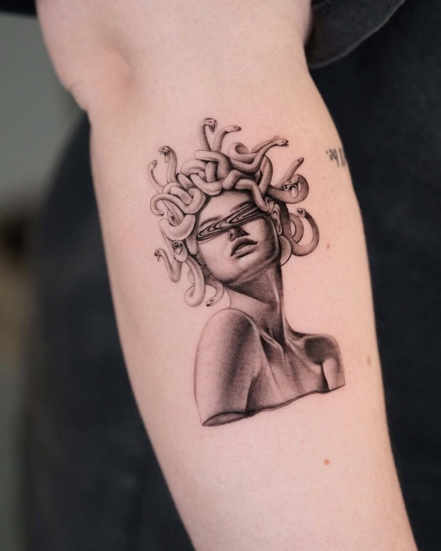 This tattoo features Medusa, the mythical figure known for her snake hair and petrifying gaze.