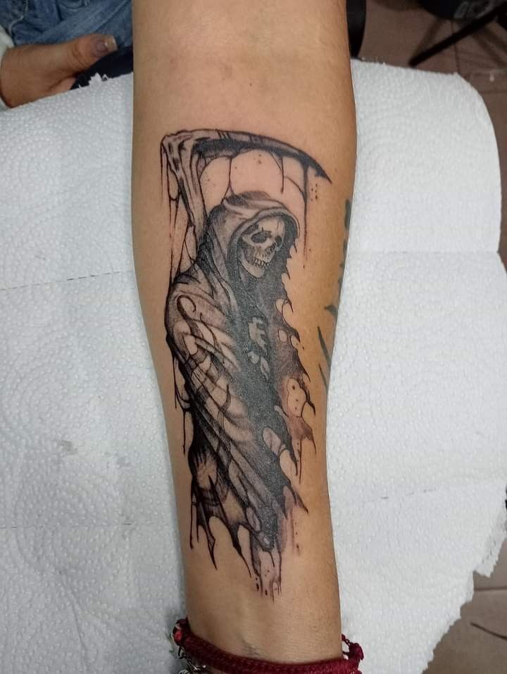 Watercolor Shadow Reaper on the Forearm, a tattoo design rendered in clean detailed linework for the hand.