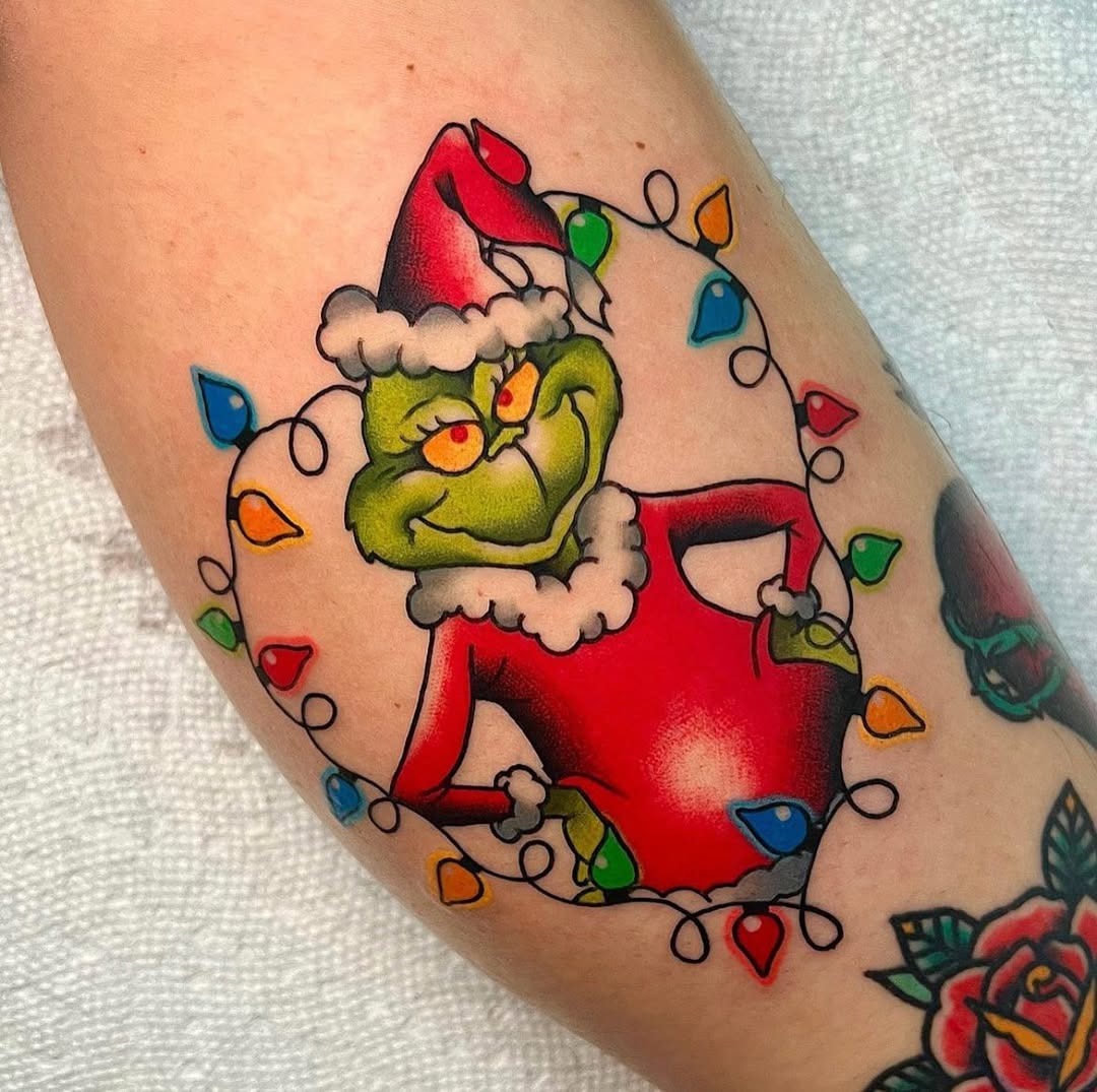 Colorful Grinch Tattoo with Christmas Lights Tattoo Design