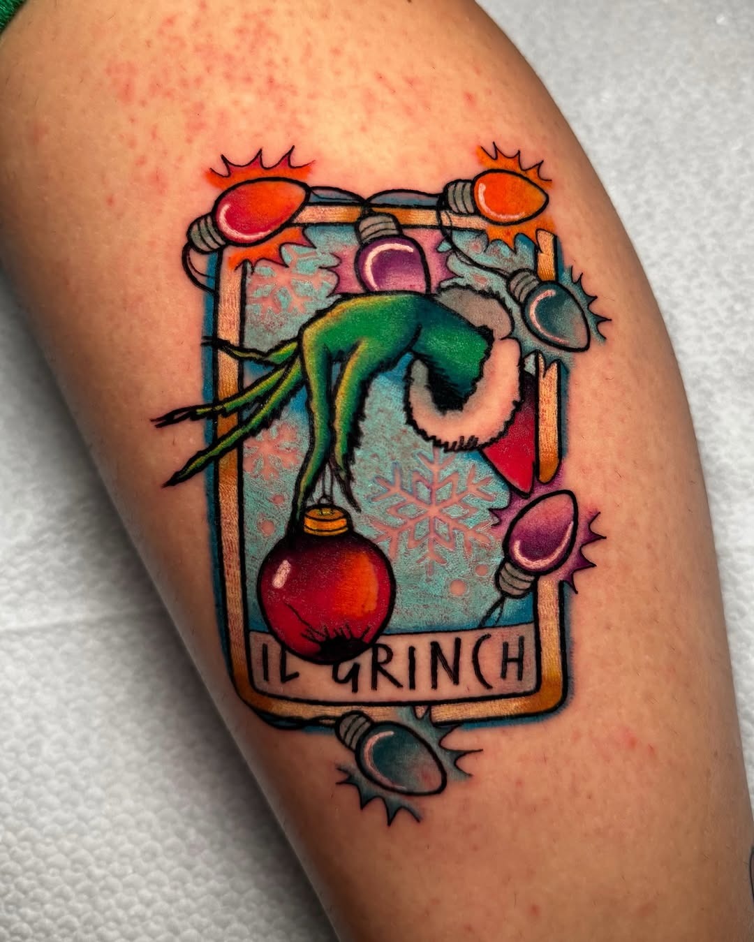 Festive Grinch Tattoo with Holiday Elements Tattoo Design