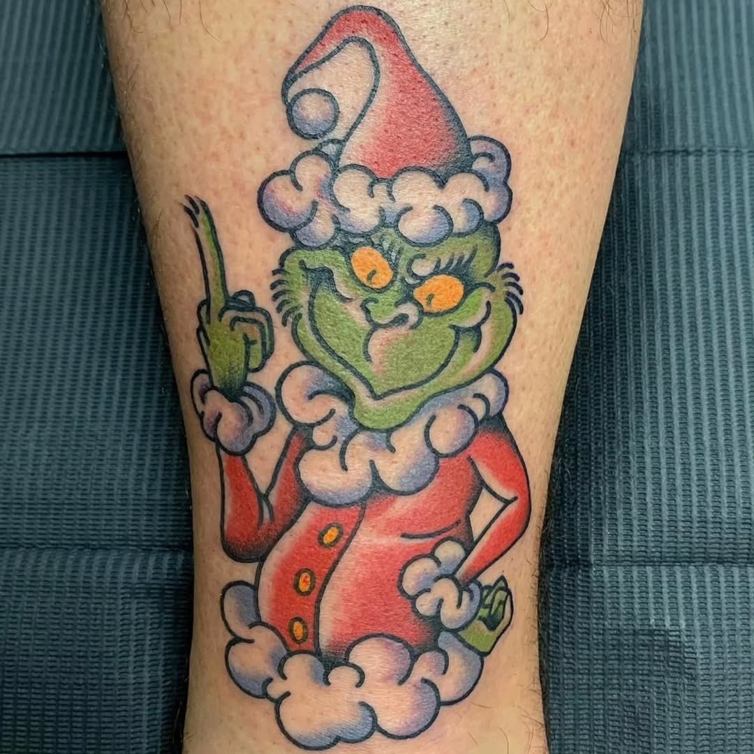 Festive Grinch with a mischievous flair Tattoo Design