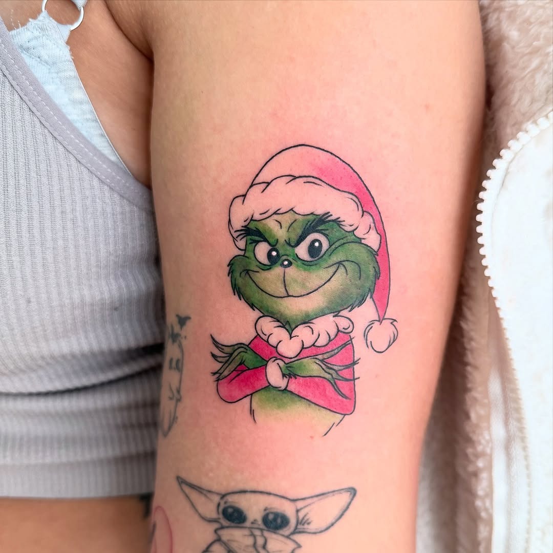Playful Grinch Design with Santa Hat Tattoo Design