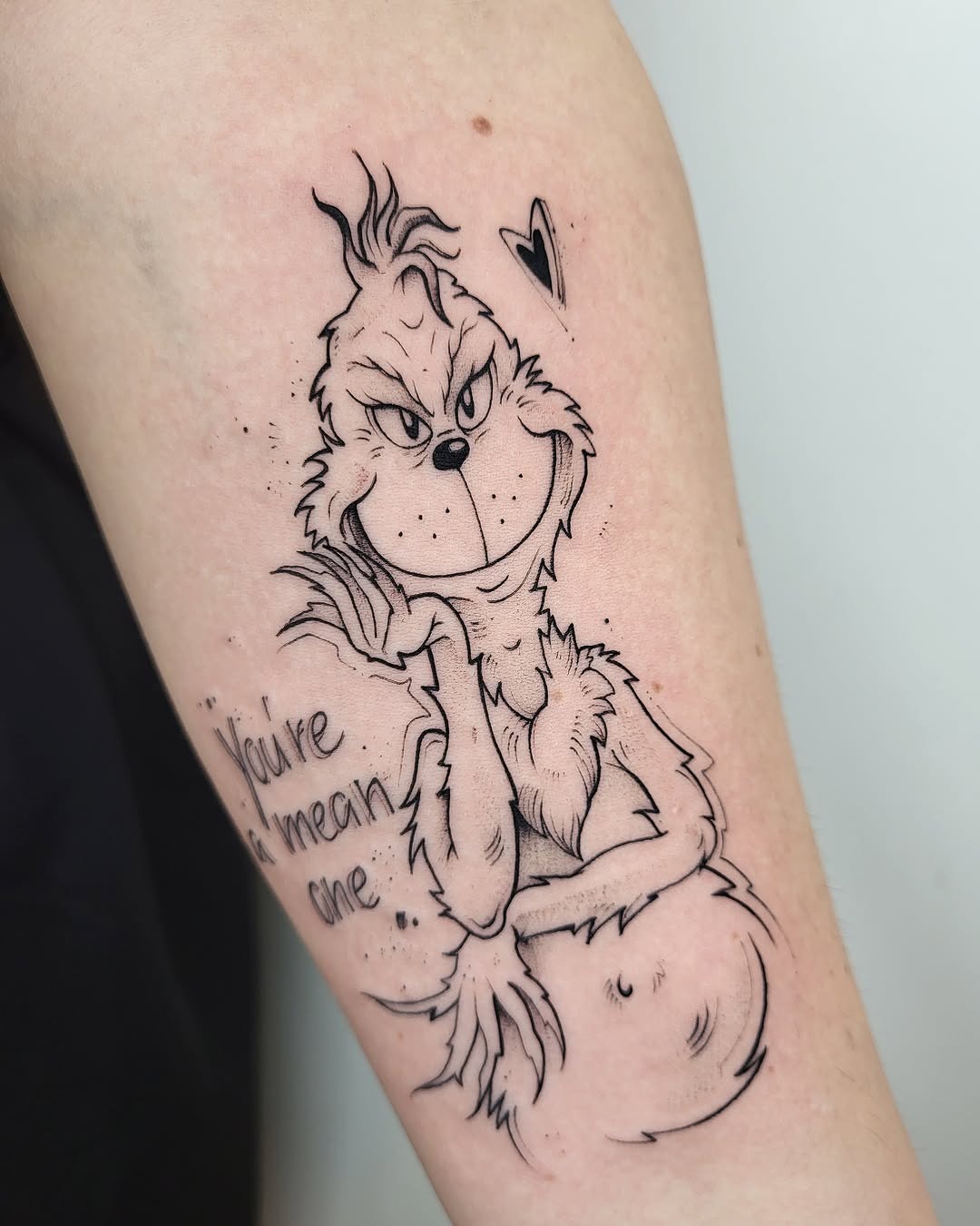 Playful Grinch Tattoo with a Cheeky Vibe Tattoo Design