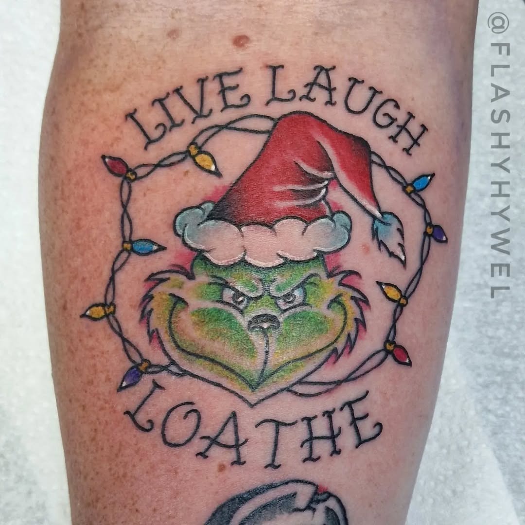 Playful Grinch Tattoo with a Holiday Twist Tattoo Design
