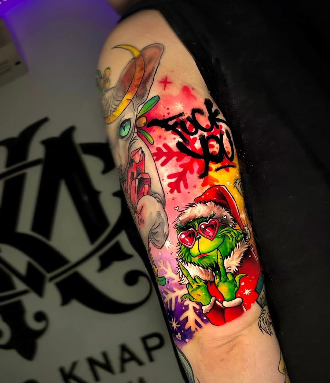 Vibrant Grinch Tattoo with a Twist Tattoo Design