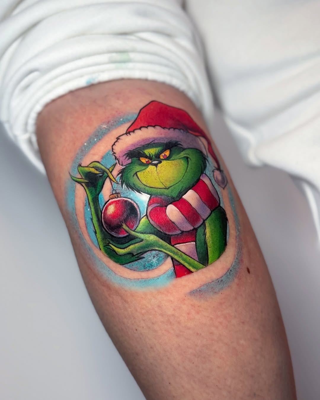 Vibrant Grinch Tattoo with Holiday Spirit Tattoo Design