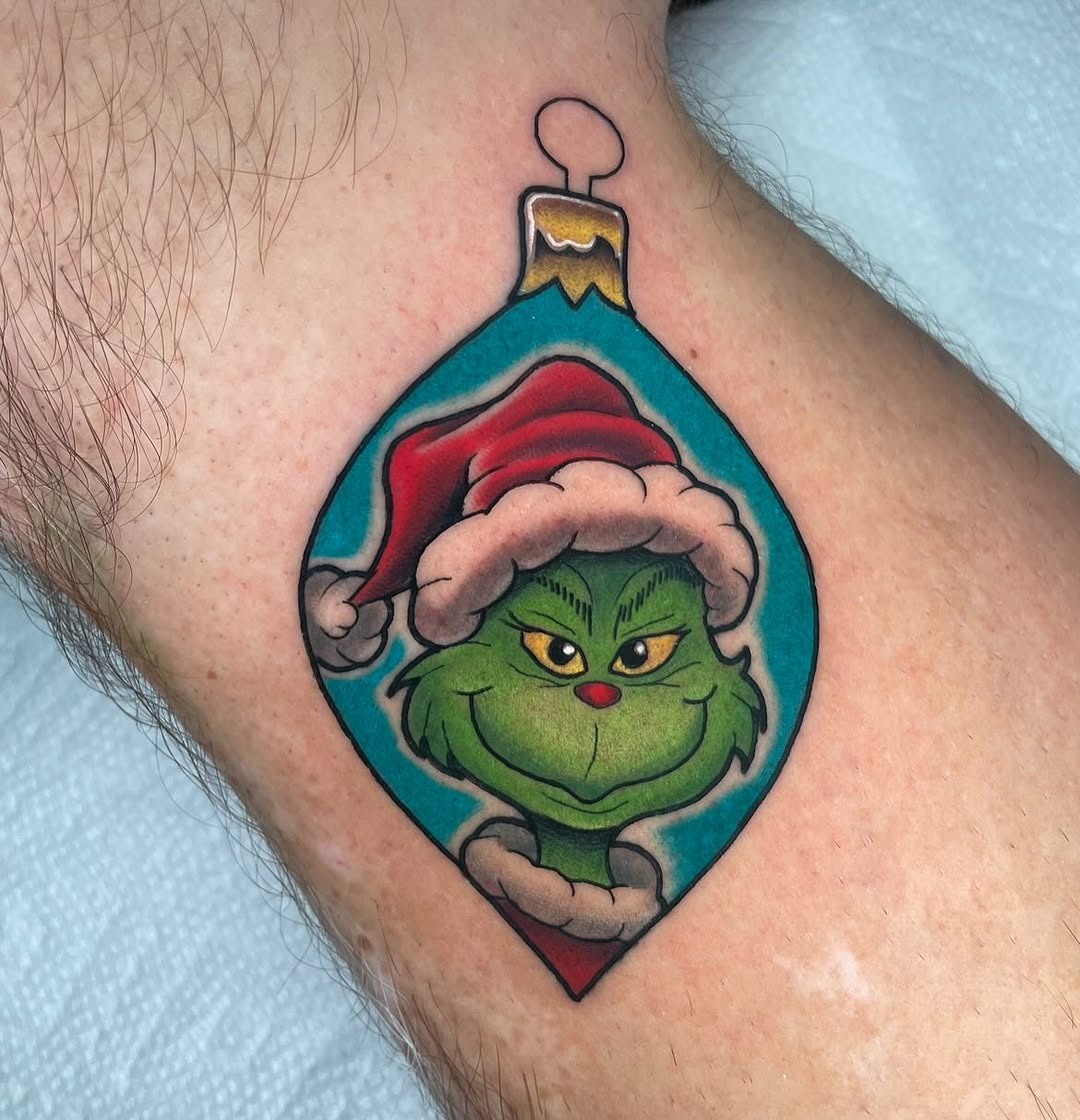Whimsical Grinch in festive ornament tattoo design Tattoo Design