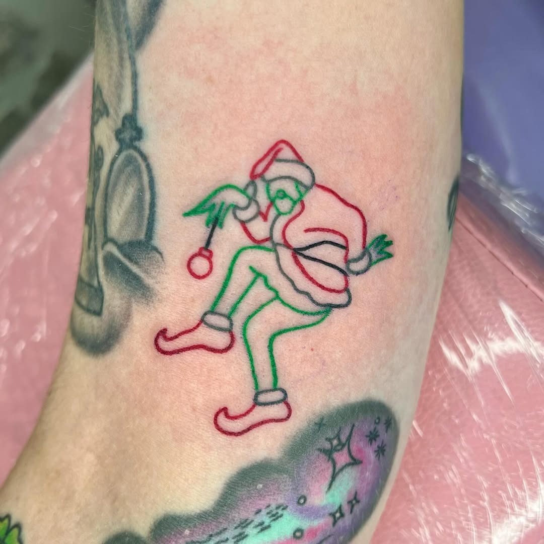 Whimsical Grinch Tattoo for Holiday Cheer Tattoo Design