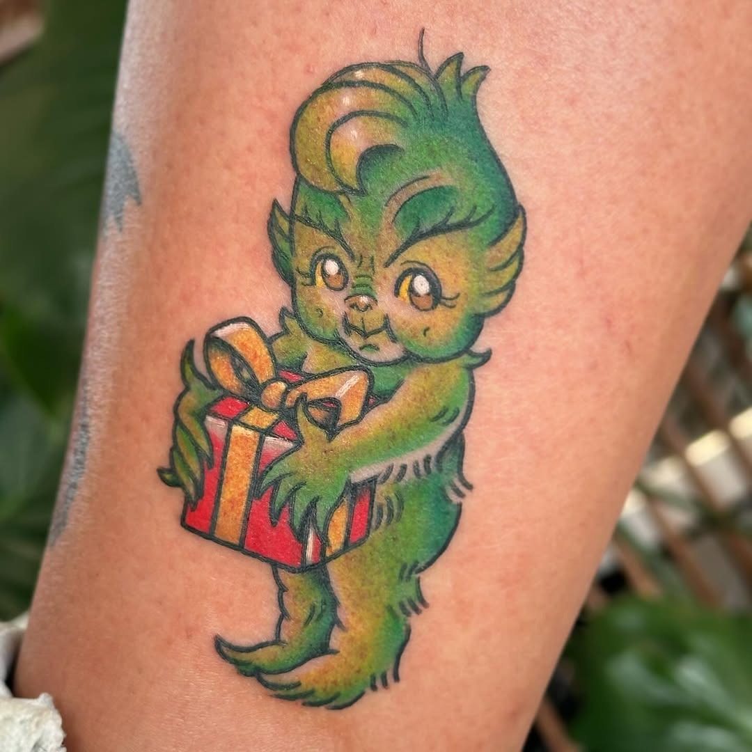 Whimsical Grinch Tattoo with Christmas Gift Tattoo Design