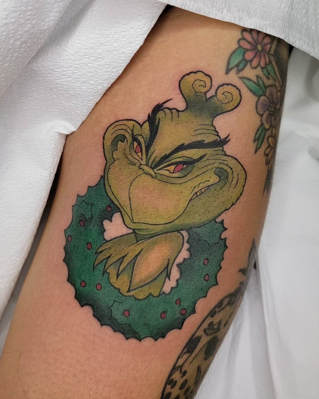 Whimsical Grinch with Holiday Vibes Tattoo Design