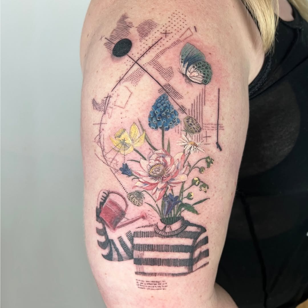 Artful floral arrangement tattoo with playful elements Tattoo Design