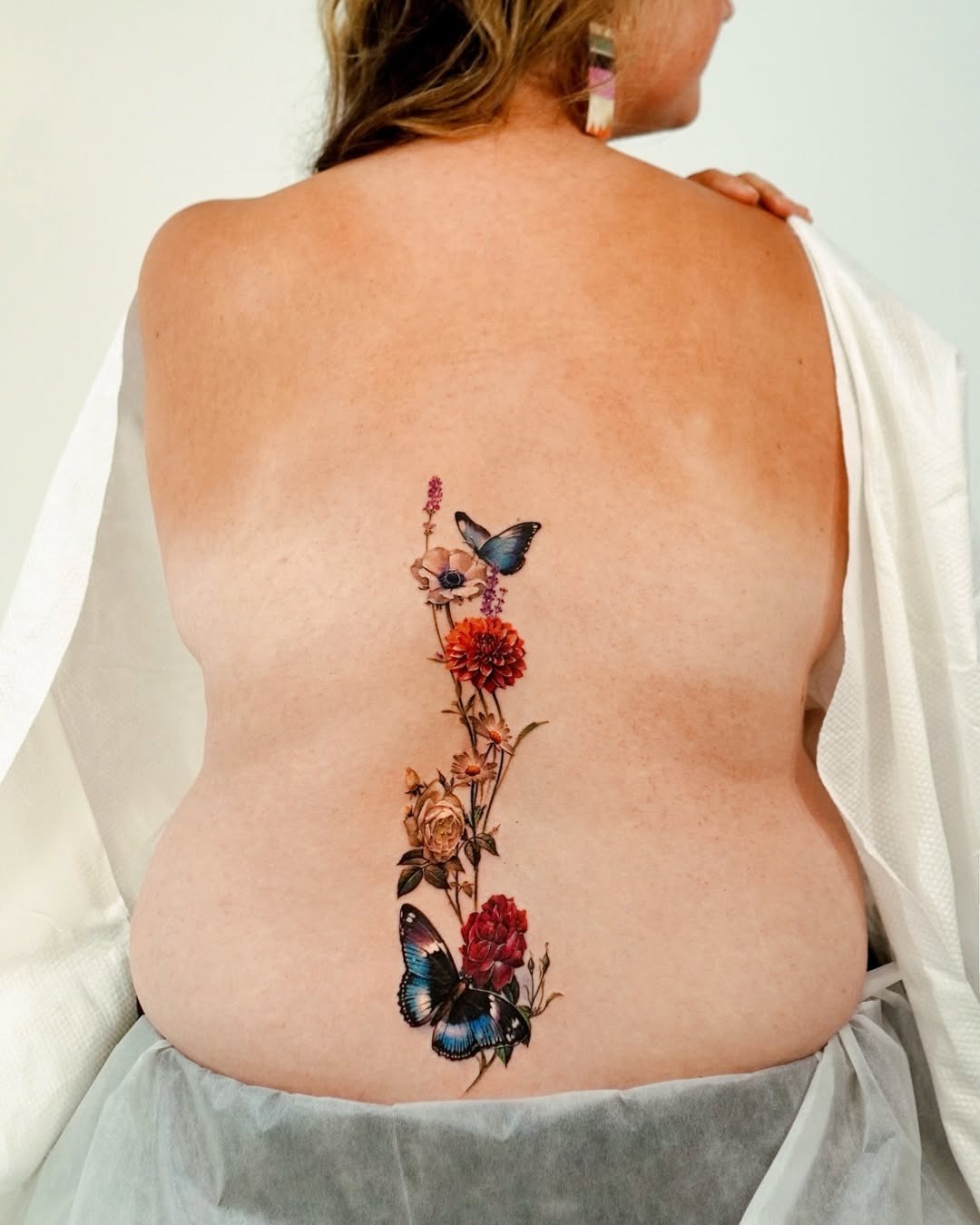Beautiful floral and butterfly growth tattoo design Tattoo Design