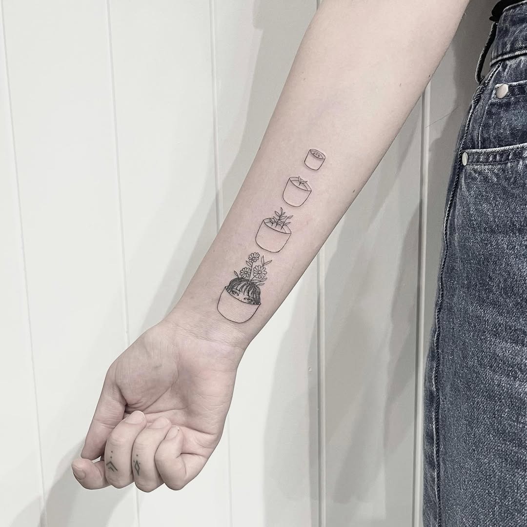 Charming potted plant tattoos for growth lovers Tattoo Design
