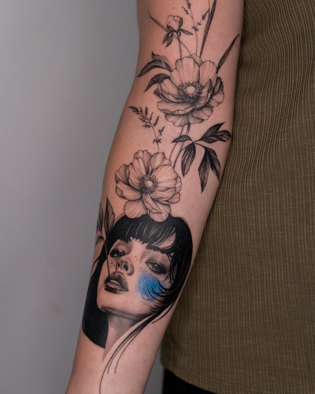 Intricate floral portrait tattoo exuding strength Tattoo Design