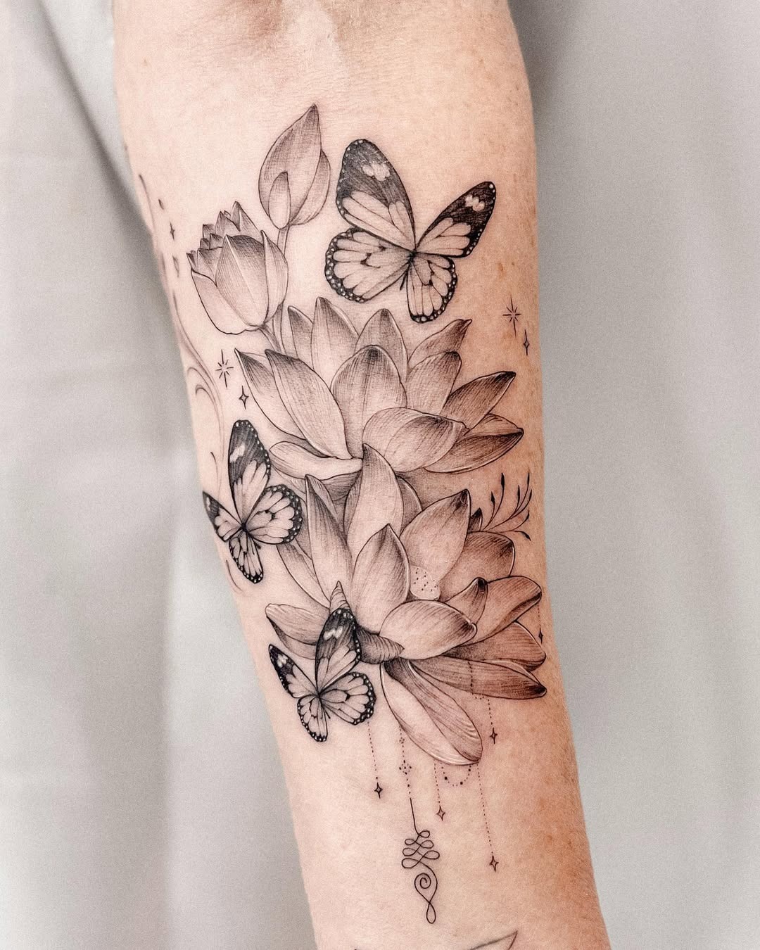 Intricate floral tattoo with delicate butterflies Tattoo Design