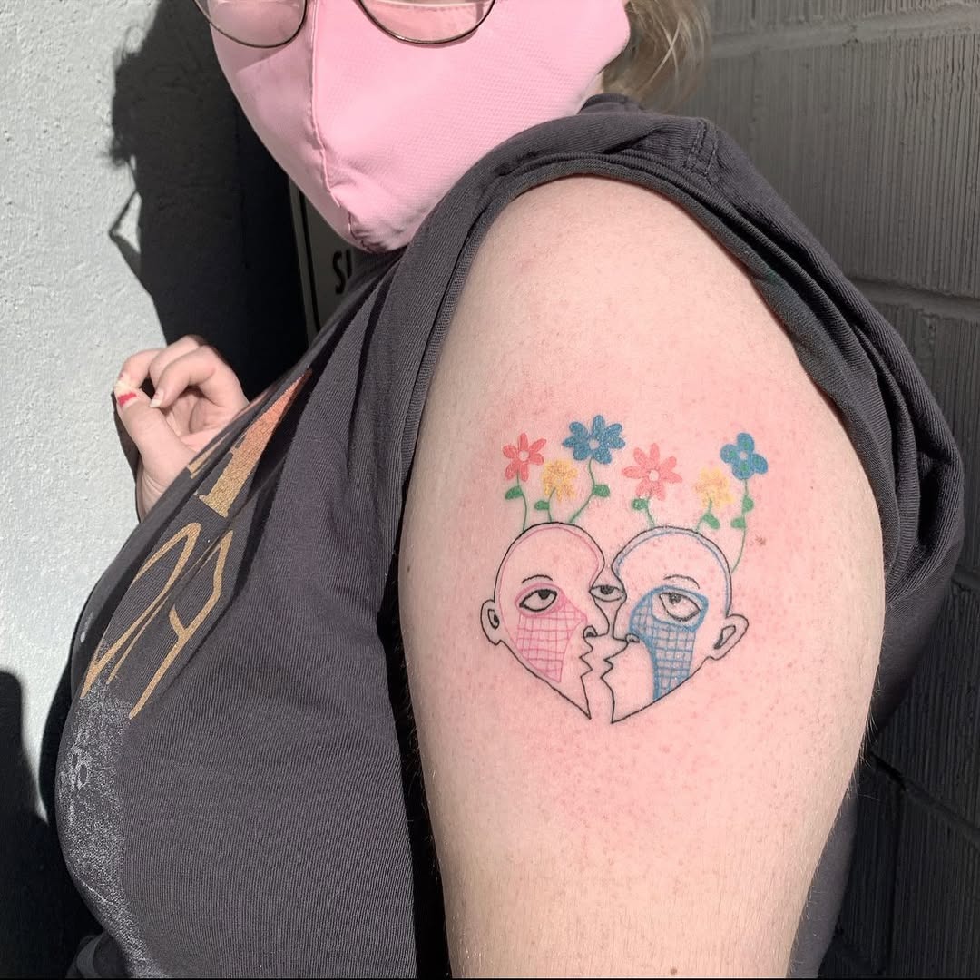 Unique Growth Tattoo of a Couple with Flowers Tattoo Design