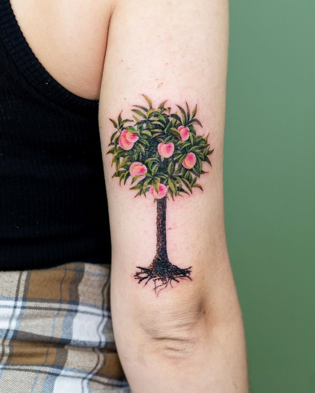 Vibrant tree tattoo with blooming pink flowers Tattoo Design