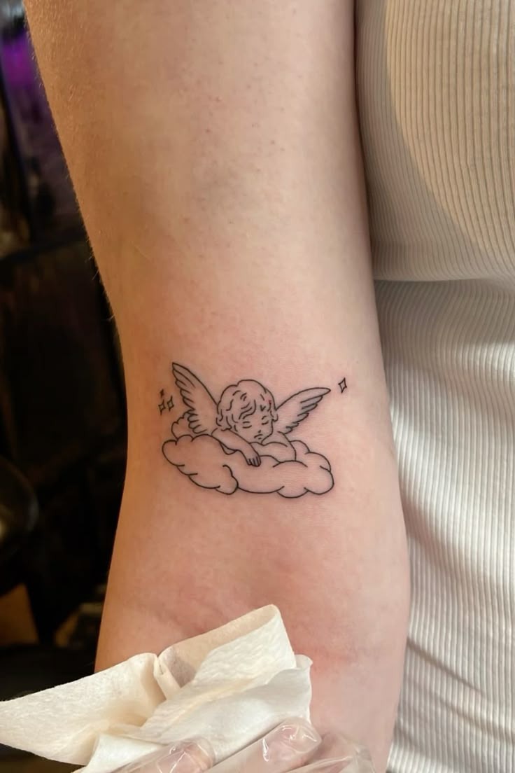 Angel in Grief with Folded Wings Tattoo Design