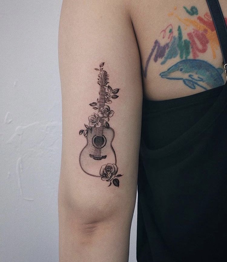 Delicate Acoustic Guitar With Climbing Roses Tattoo Design
