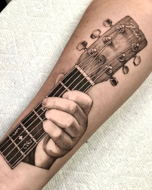 Hyper-Realistic Fender Fretting Hand Tattoo Design
