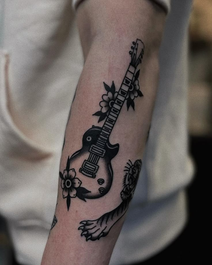 Rose-Wrapped Black Guitar Tattoo Tattoo Design
