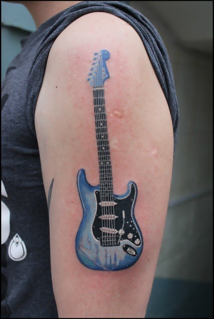 Shimmering Blue Electric Shoulder Guitar Tattoo Design