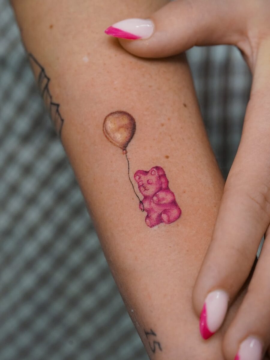 Charming Gummy Bear Tattoo Holding Balloon Tattoo Design